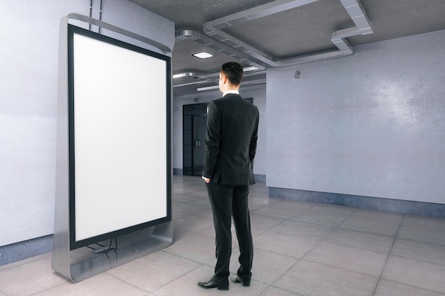 Man looking at blank banner