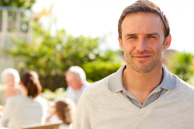 Man looking at the camera in the garden