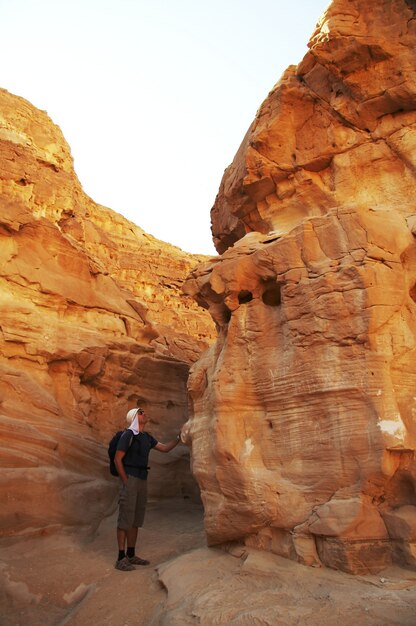 Man looking on colorful canyon in Egypt