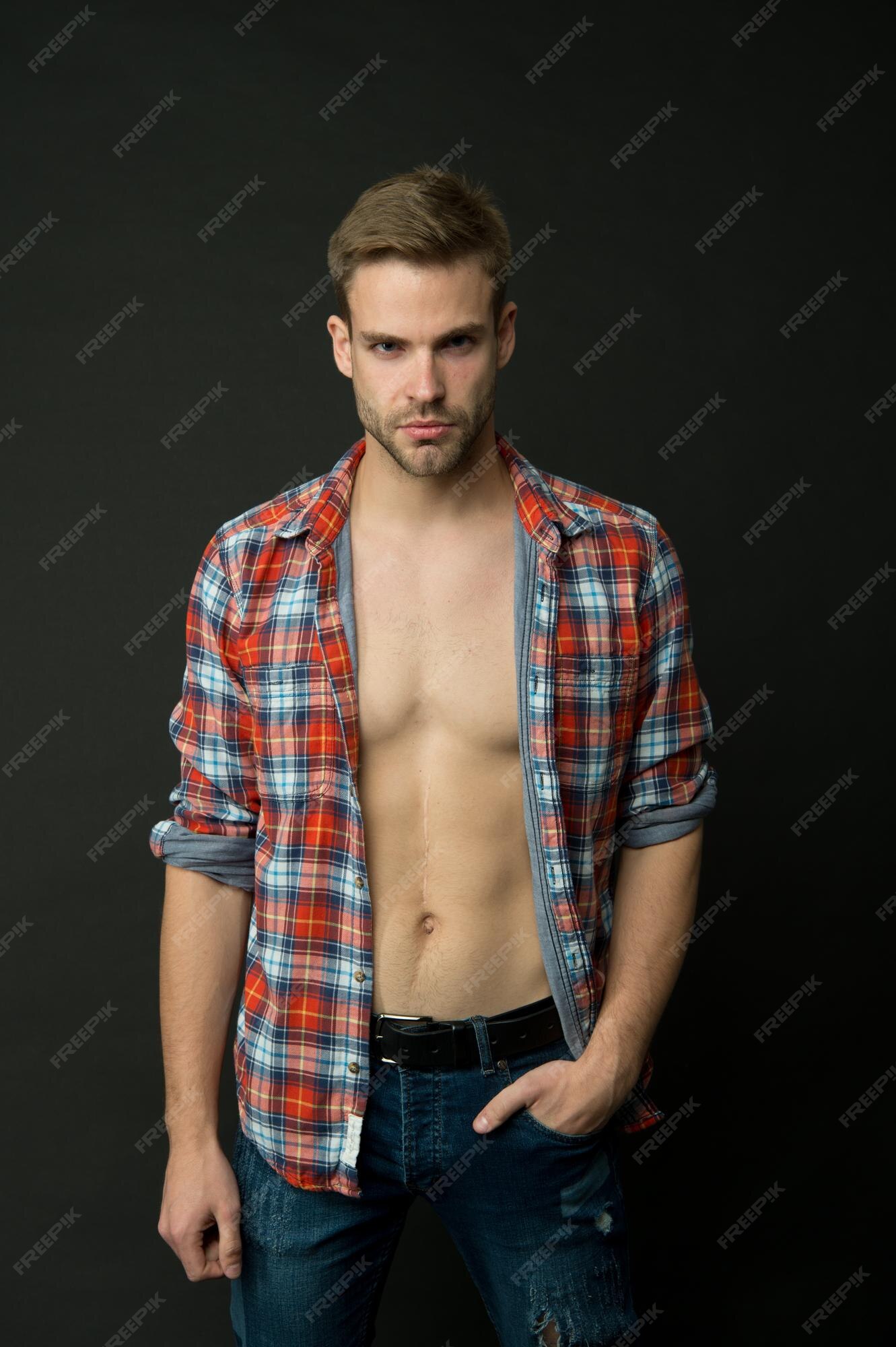 Premium Photo | Man looking his best man on dark background handsome man with bare torso caucasian guy with beard and stylish hair sexy man casual style fashion style