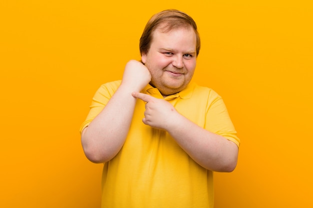 Man looking impatient pointing at watch