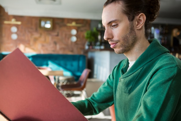 Man looking at menu