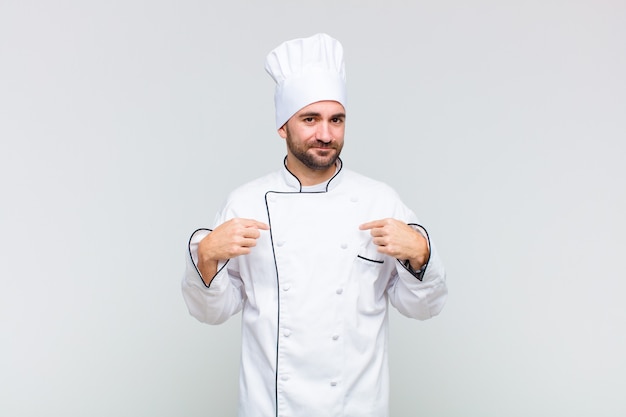 Man looking proud pointing to chest with both hands