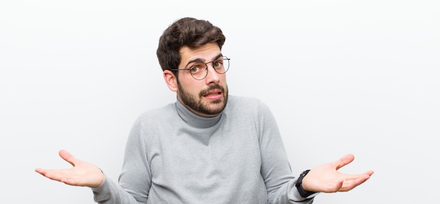 man looking puzzled, confused and stressed, wondering between different options, feeling uncertain