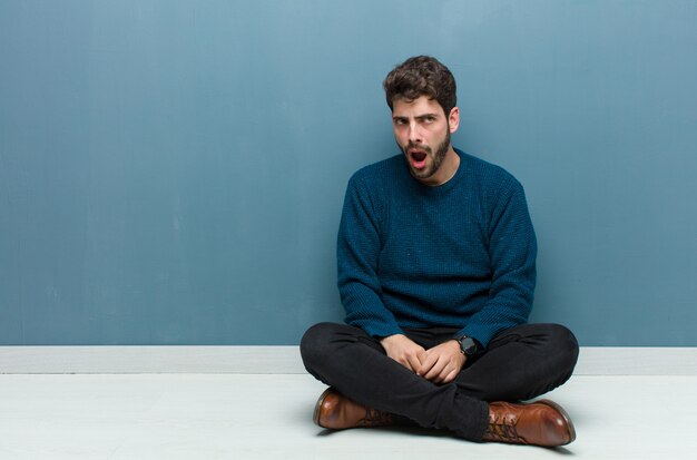 man looking shocked, angry, annoyed or disappointed, open mouthed and furious