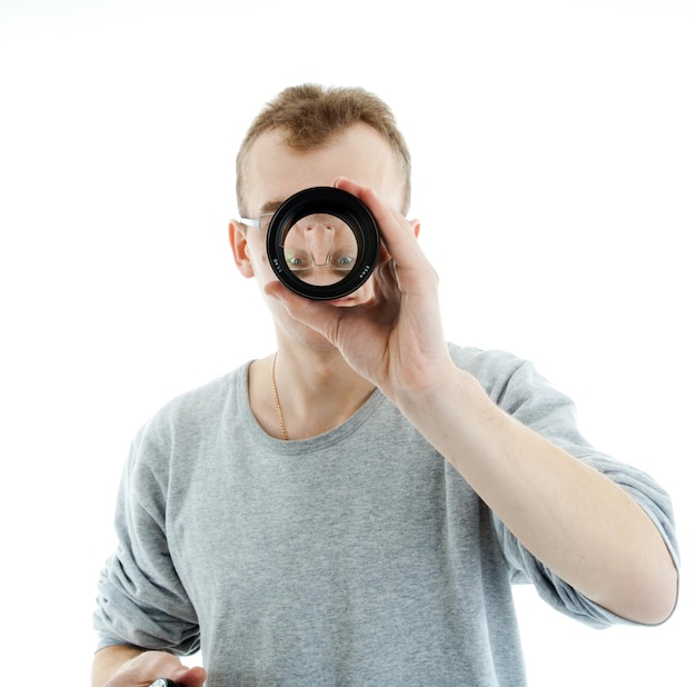 man looking through a lens