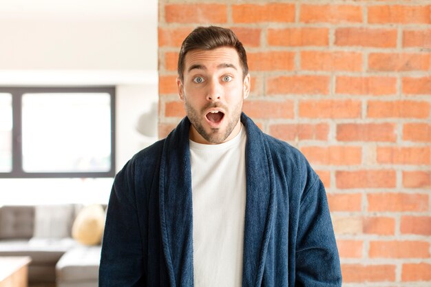 man looking very shocked or surprised, staring with open mouth saying wow