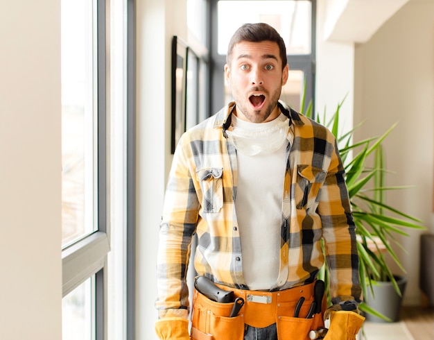 man  looking very shocked or surprised, staring with open mouth saying wow