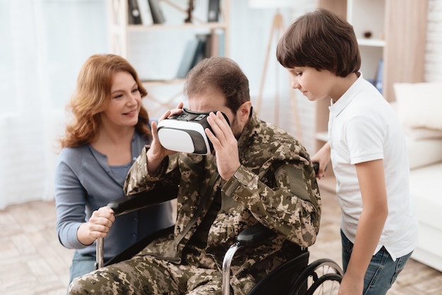 A man looks into virtual reality glasses.