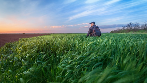 Man looks at the sky. bright spring landscape