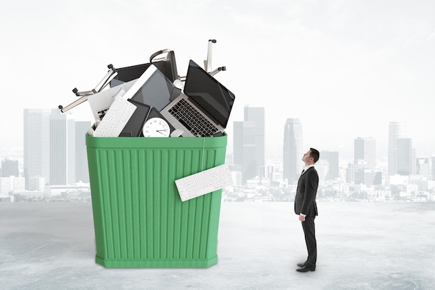 Man looks at the trash can with office furniture and accessories concept