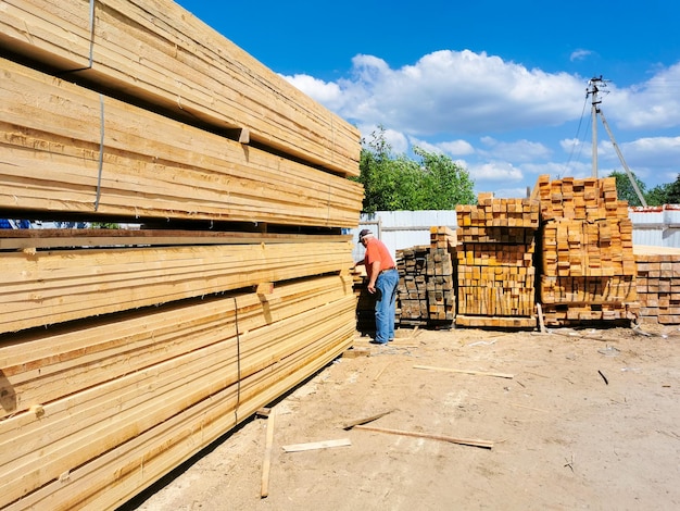 A man in a lumber yard outdoors