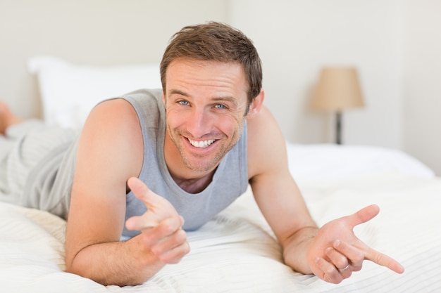 Man lying down on his bed