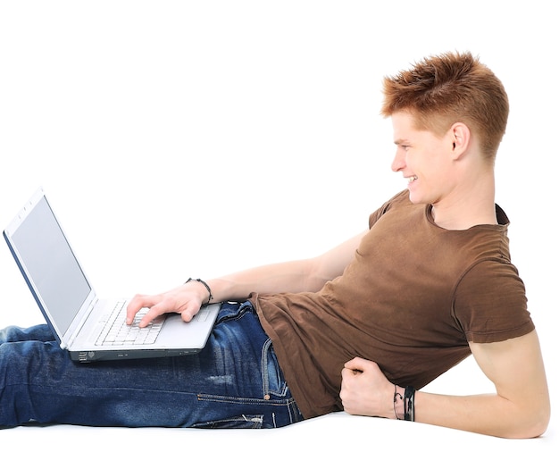  man lying on the floor using a laptop computer