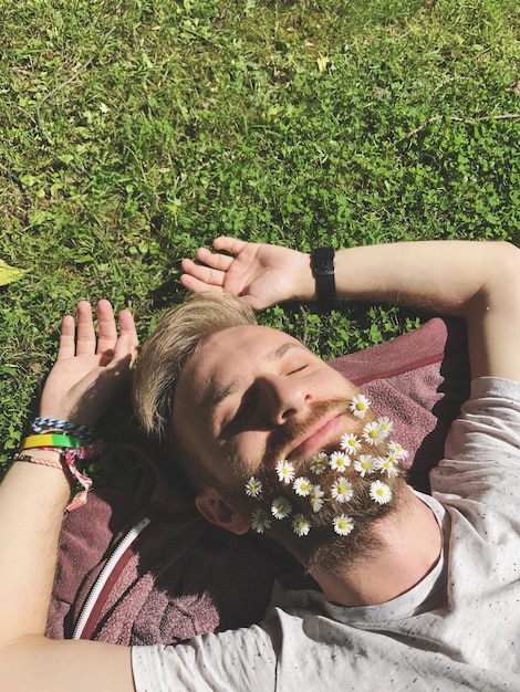 man lying on grass