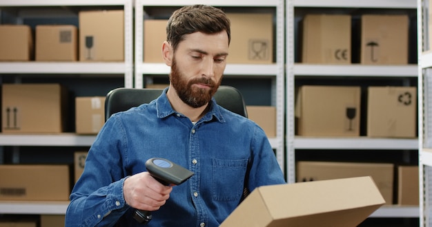 Man mail worker scanning parcel