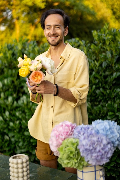 Man makes a bouquet in garden