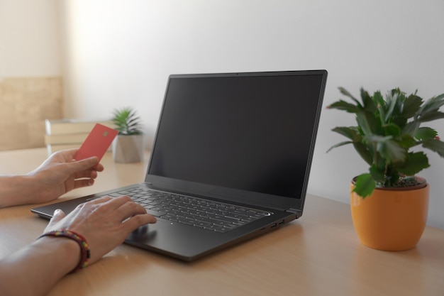 Photo man making a credit card purchase on the internet