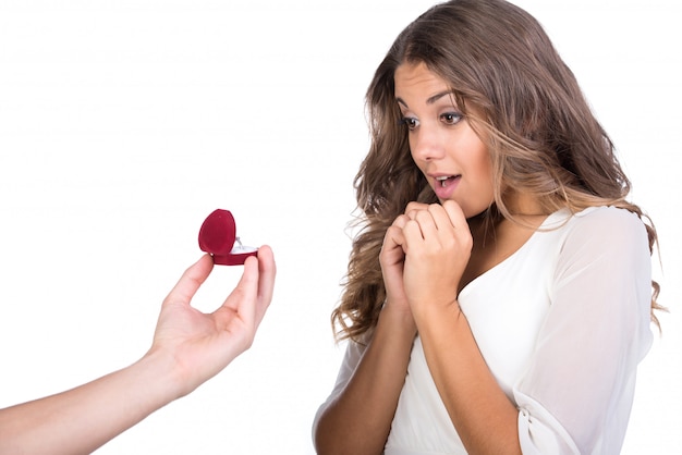 Man making propose with wedding ring in gift box.