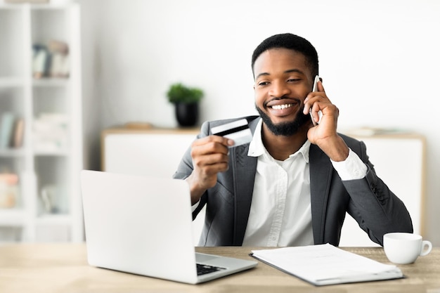 man making a purchase on the phone