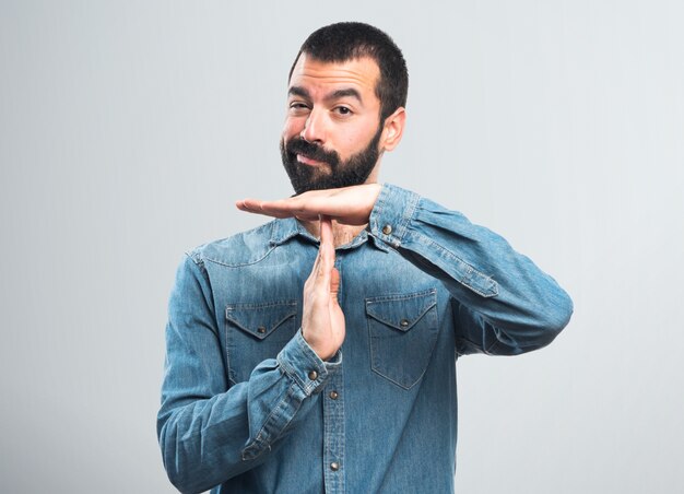 Man making time out gesture