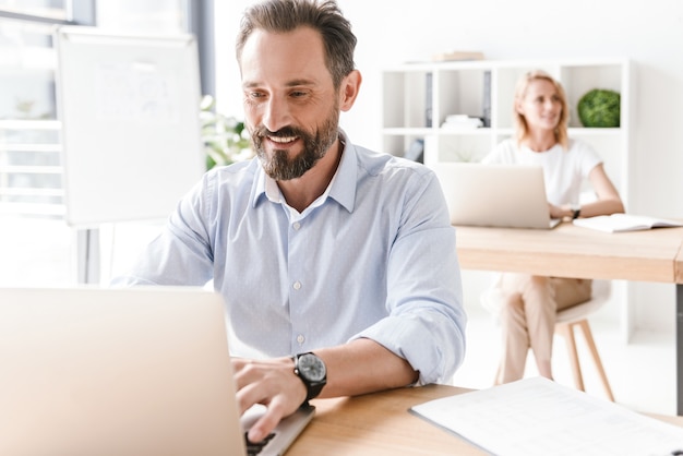 man manager working on laptop