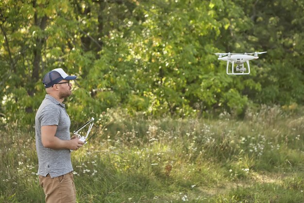 Man manages quadrocopters Remote control for the drone in the hands of men Unmanned aerial vehicle