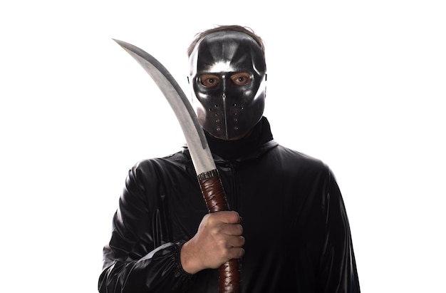 man in mask of maniac with machete isolated on white background