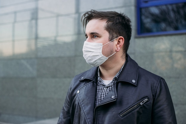 Man in mask to prevent infection, coronavirus concept