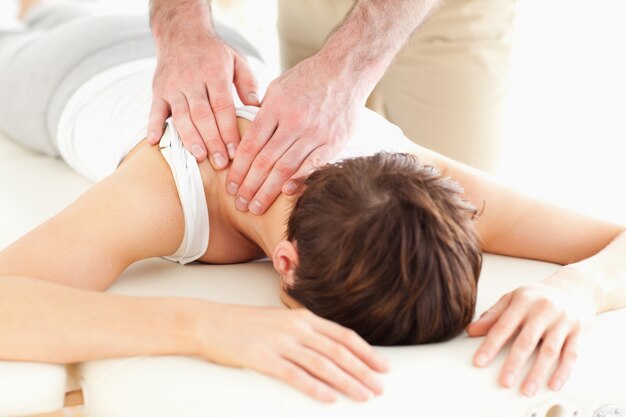 Man massaging a woman's neck