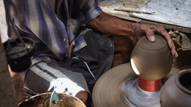 A man mold the pottery with cray at Koh Kred Nonthaburi Thailand