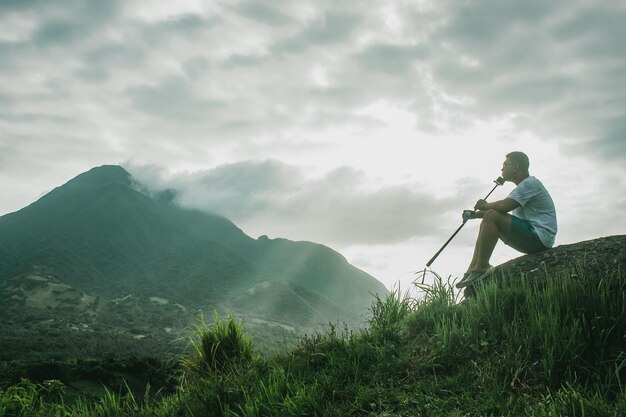 Man on mountain against sky