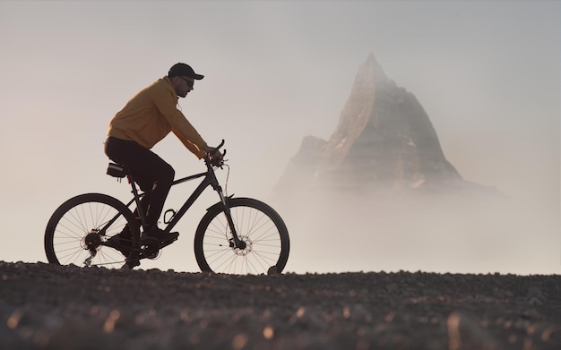 man on a mountain bike rides in a picturesque mountainous area active lifestyle theme