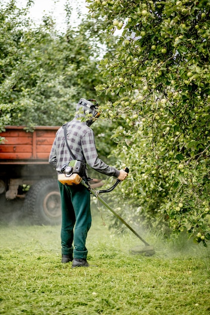 Man mowing the lawn in his garden