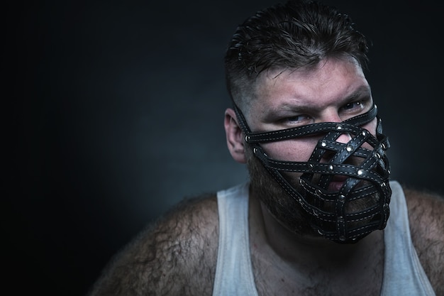 Man in muzzle