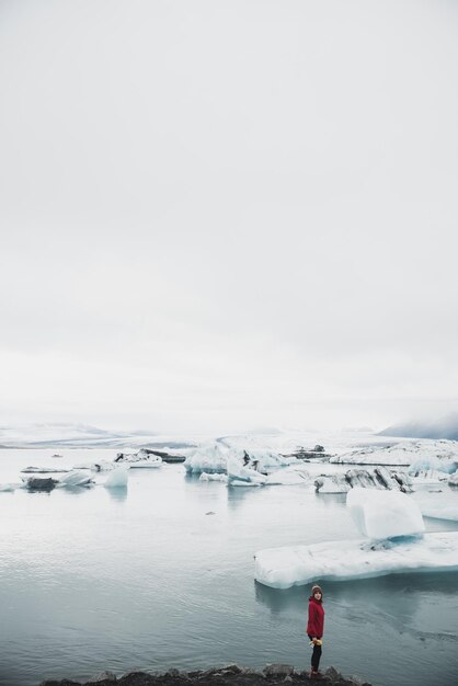 Man near glacier in Iceland