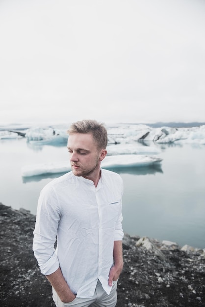 Man near glacier in Iceland