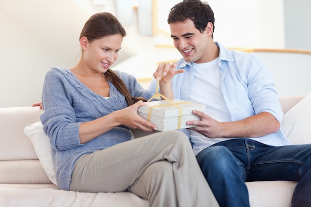 Man offering a gift to his wife