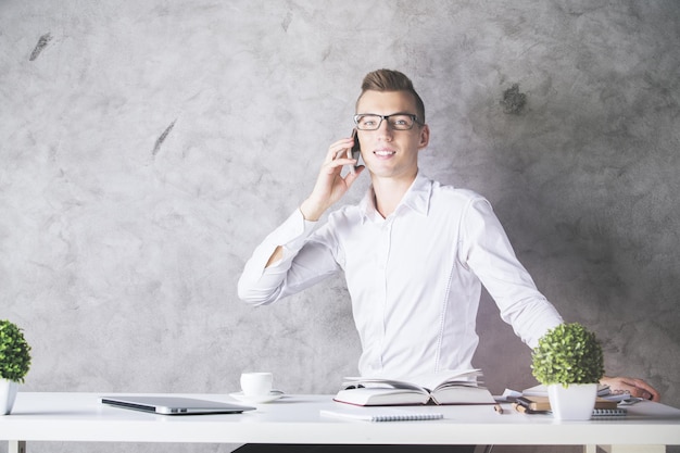 Man in office talking on phone