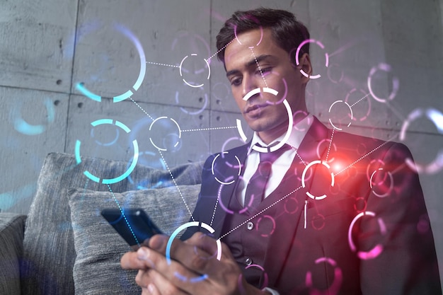 Man in office working with Smartphone Searching for new tech Abstract technology hologram typing phone Double exposure