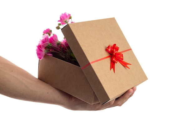 Man opening a gift box full of flowers