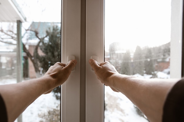 The man opens the window. Wide angle first person view.