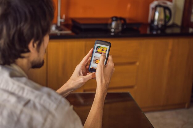 Man orders food for lunch online using smartphone