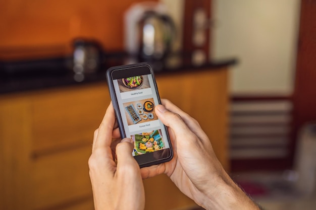 man orders food for lunch online using smartphone