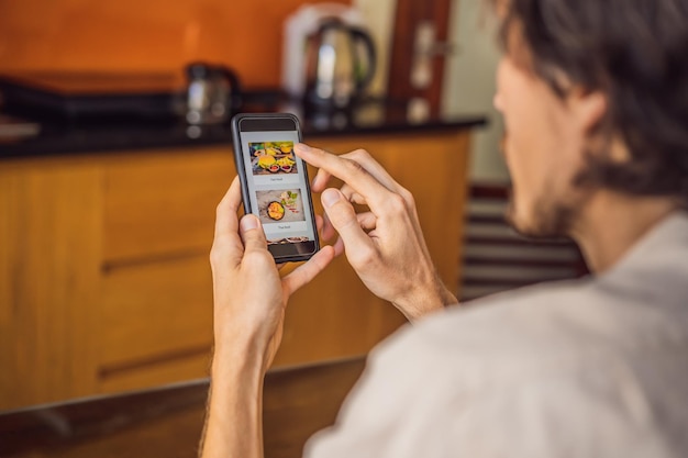 Man orders food for lunch online using smartphone