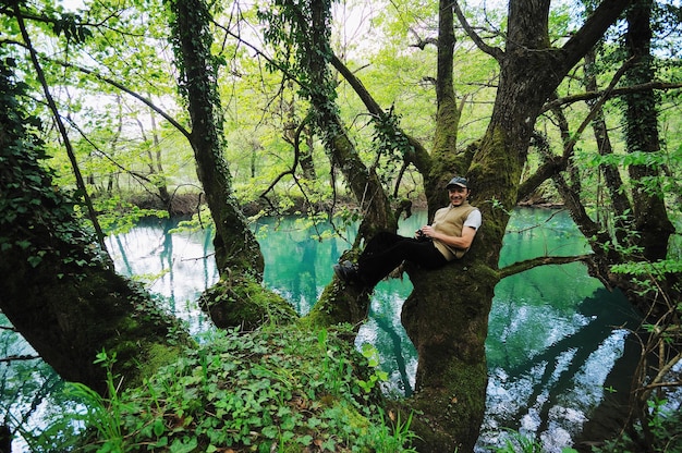 man outdoor in nature relaxing