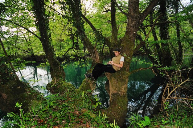 man outdoor in nature relaxing