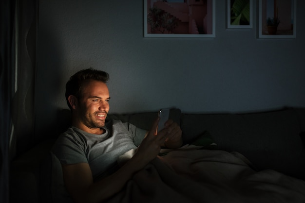 Man in pajamas with a mobile phone