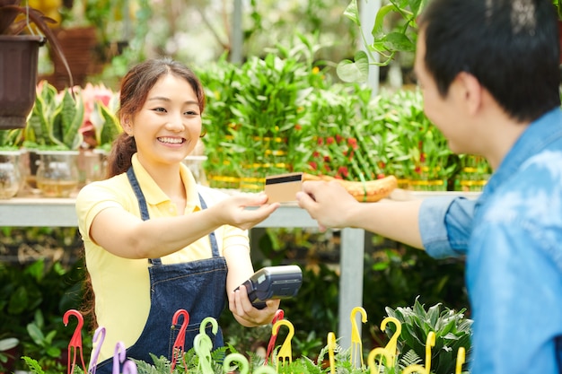 Man Paying for Plants