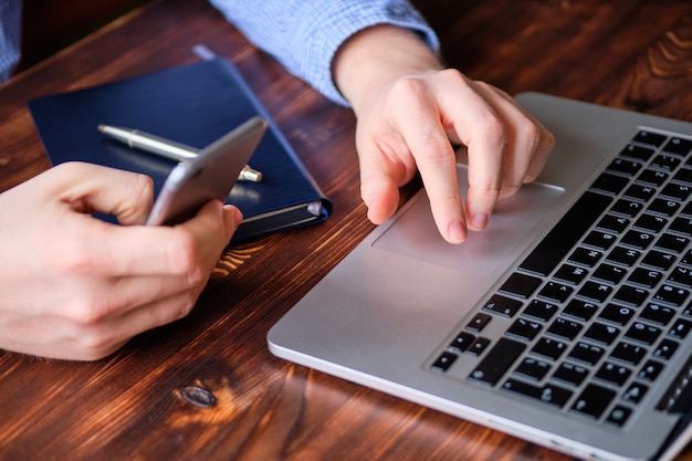 The man performs the work remotely. The concept of a freelancer and a hired worker.